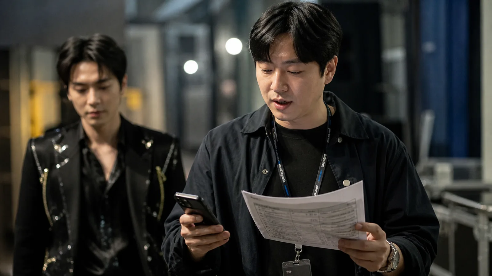 Artist manager guiding a performer backstage